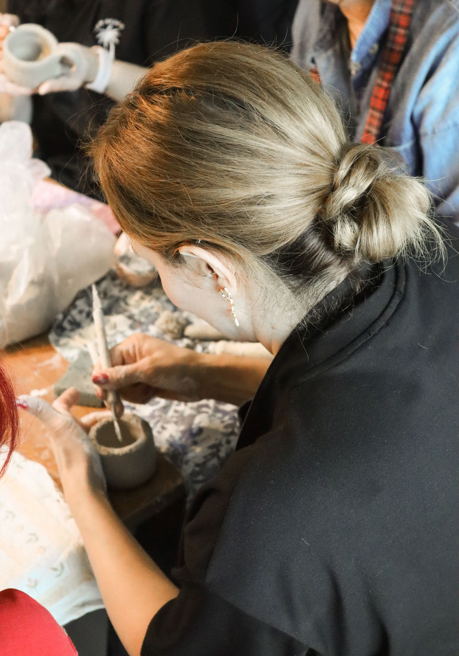 People learning and making together around a workshop table