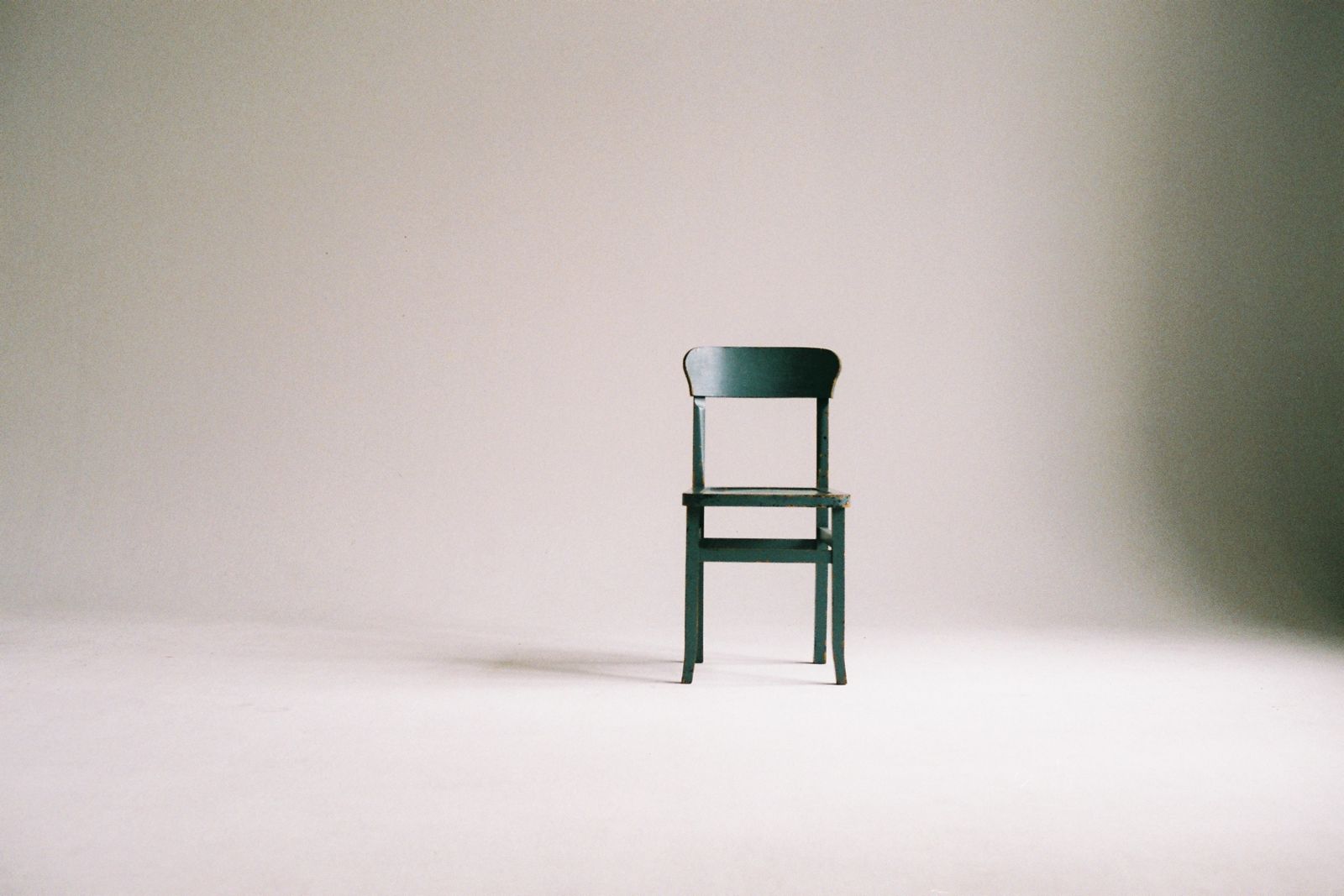 Wooden chair in a calm studio space